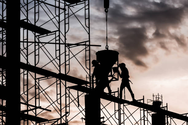 istock Silhouette of worker in the construction site 1138886914