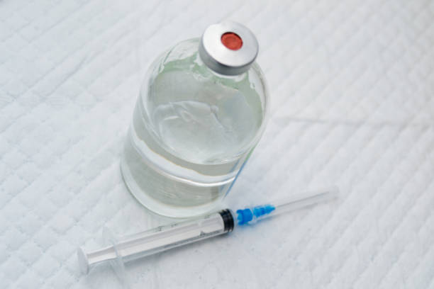 istock vial with clear drug solution and a syringe 1138886948