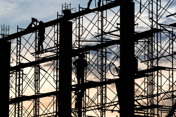 istock Silhouette of worker in the construction site 1138887070