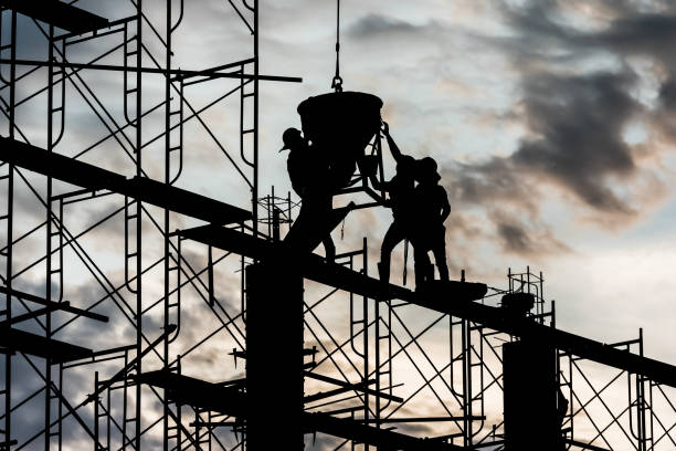 istock Silhouette of worker in the construction site 1138887120