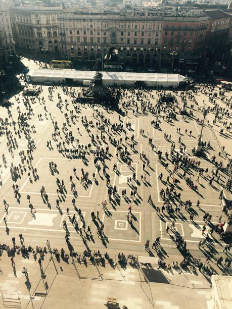istock People and shadows in a big square 1138887484