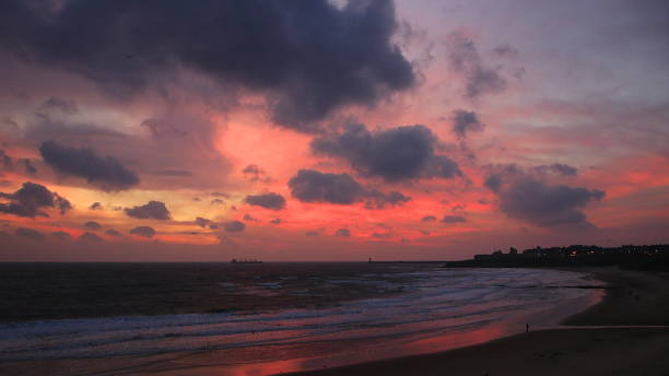 istock Cloudy sunrise on Tynemouth Longsands beach 1138888298
