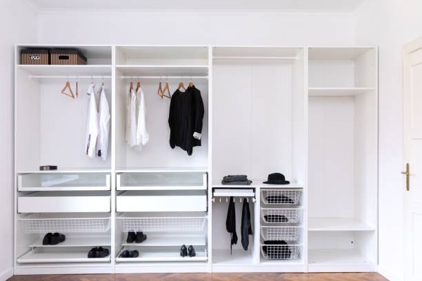 istock Big wardrobe with different clothes for dressing room 1138890557
