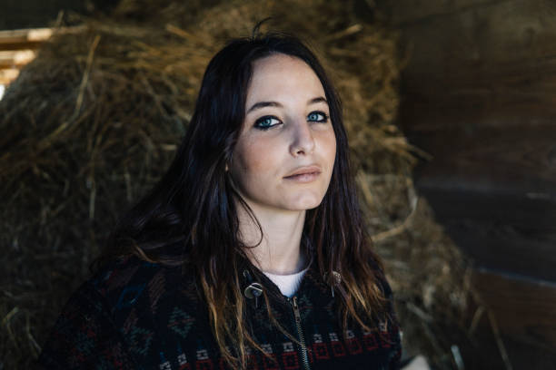 istock Young beautiful woman farmer in a stable 1138890794
