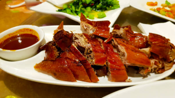 Peking duck with sauce. Chinese cuisine stock photo