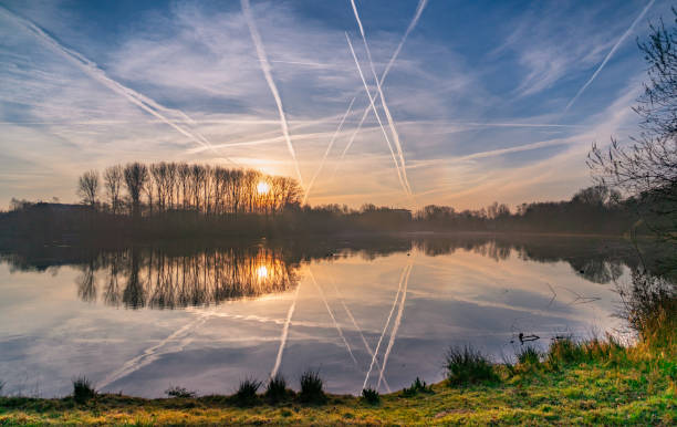 Sunrise over lake Sunrise over lake Padersee paderborn stock pictures, royalty-free photos & images