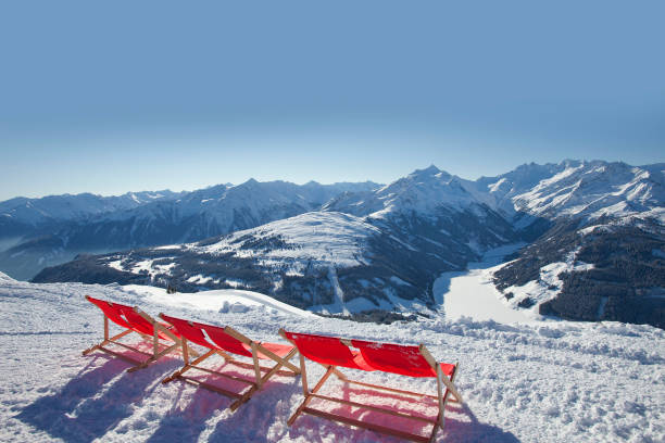 istock red deck chairs on the snow in ski resort 1138892931