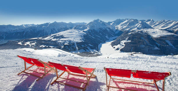 istock red deck chairs on the snow in ski resort 1138892932