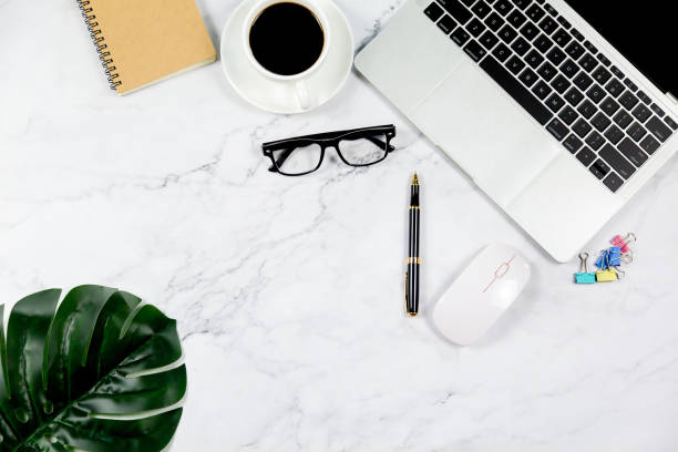 istock Workspace in office , Marble White desk with blank notebook and other office supplies,Top view with copy space. 1138895098