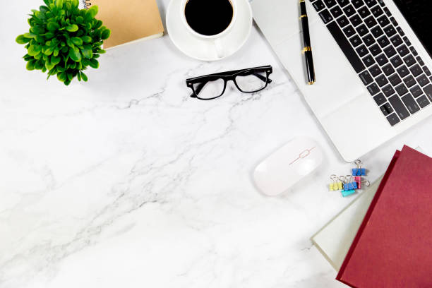 istock Workspace in office , Marble White desk with blank notebook and other office supplies,Top view with copy space. 1138895101
