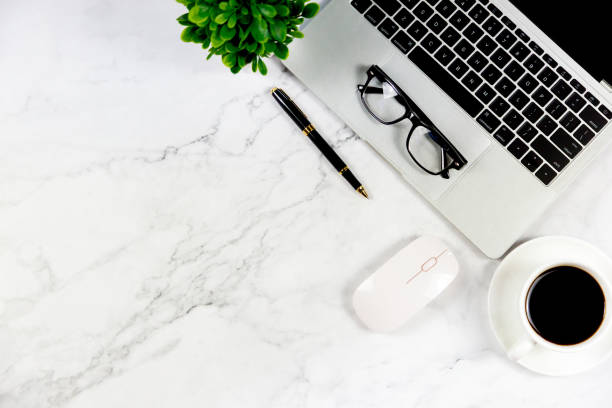 istock Workspace in office , Marble White desk with blank notebook and other office supplies,Top view with copy space. 1138895171