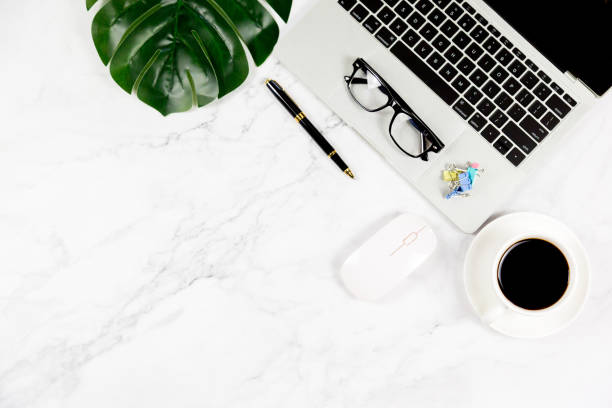 istock Workspace in office , Marble White desk with blank notebook and other office supplies,Top view with copy space. 1138895279