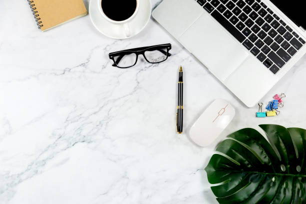 istock Workspace in office , Marble White desk with blank notebook and other office supplies,Top view with copy space. 1138895280