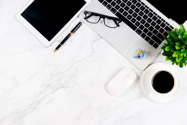 istock Workspace in office , Marble White desk with blank notebook and other office supplies,Top view with copy space. 1138895421