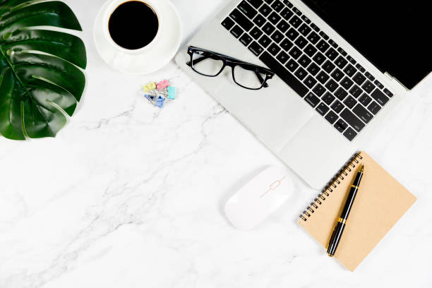 istock Workspace in office , Marble White desk with blank notebook and other office supplies,Top view with copy space. 1138896229