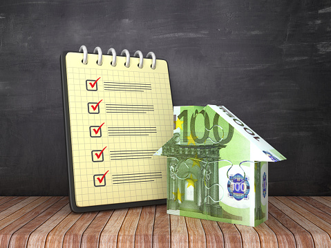 Check List Note Pad with Euro Puzzle House on Chalkboard Background  - 3D Rendering