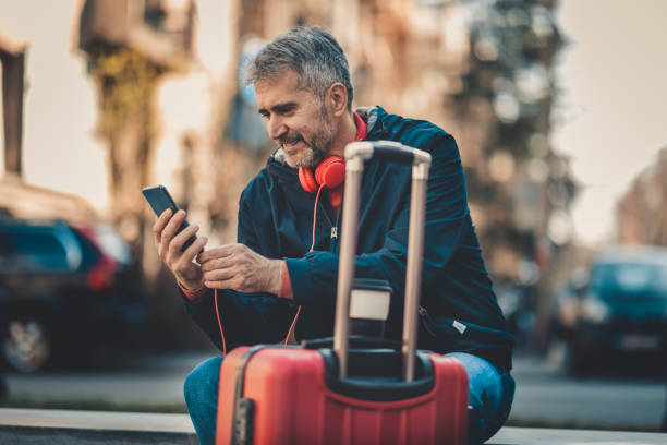 istock businessman with suitcase walking  in a city. 1138897069