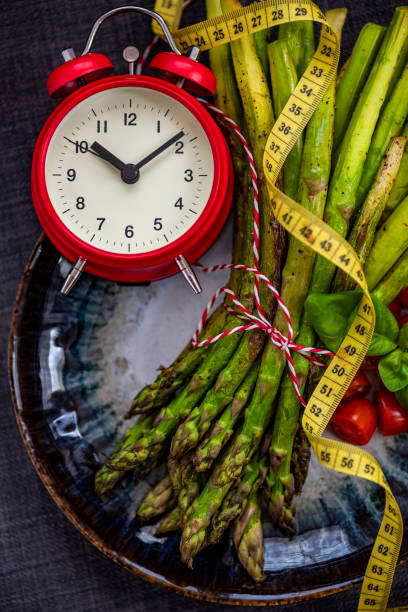 Breaking Intermittent Fasting with Grilled Asparagus stock photo