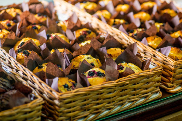 istock chocolate and berry cupcakes in a basket on the bakery window 1138898658