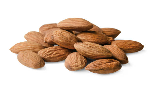 istock A bunch of almonds on a white isolated background. Close-up. 1138900078
