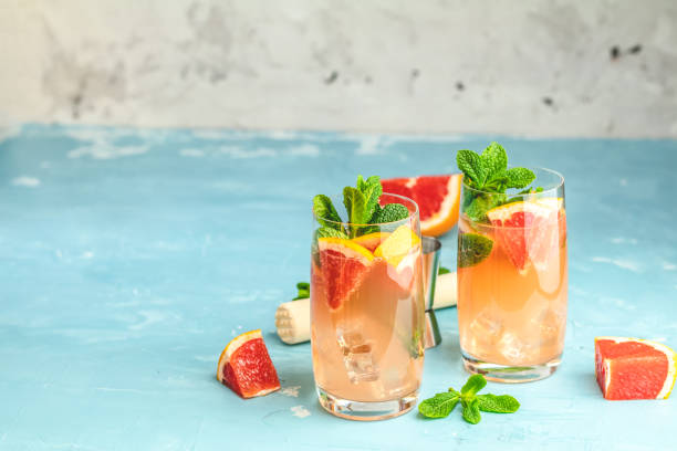 Grapefruit and fresh mint cocktail with juice stock photo