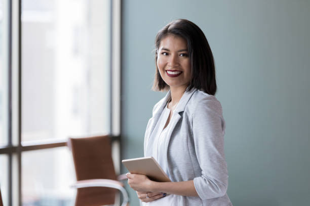 istock Confident young businesswoman in her office 1138904465