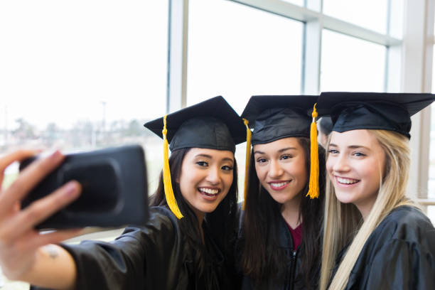 istock Female graduates take selfie 1138904499