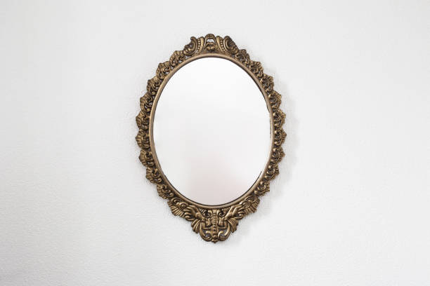 istock Golden antique mirror on white wall background texture 1138909366