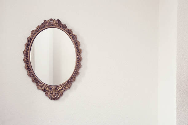 istock Golden antique mirror on white wall background texture 1138909420