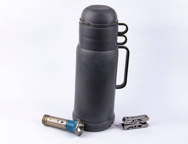 istock thermos with a cup - travel, tourist set 1138910787