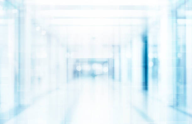 istock Abstract blurred interior of corridor clinic background in blue color , blurry image 1138910852