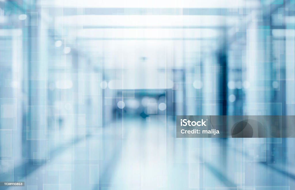 Abstract blurred interior of corridor clinic background in blue color , blurry image abstract defocused blurred technology space background, empty business corridor or shopping mall. Medical and hospital corridor defocused background with modern laboratory (clinic) Backgrounds Stock Photo