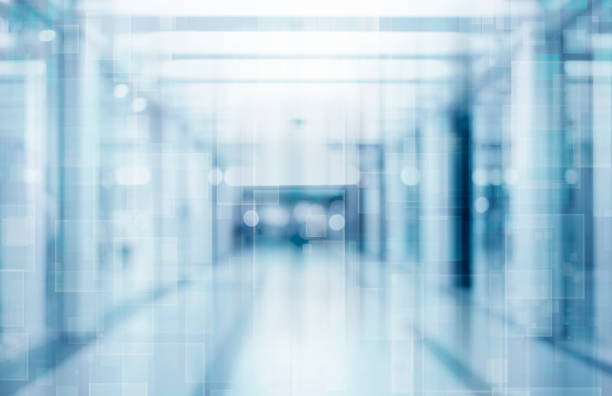 Abstract blurred interior of corridor clinic background in blue color , blurry image abstract defocused blurred technology space background, empty business corridor or shopping mall. Medical and hospital corridor defocused background with modern laboratory (clinic) building feature photos stock pictures, royalty-free photos & images