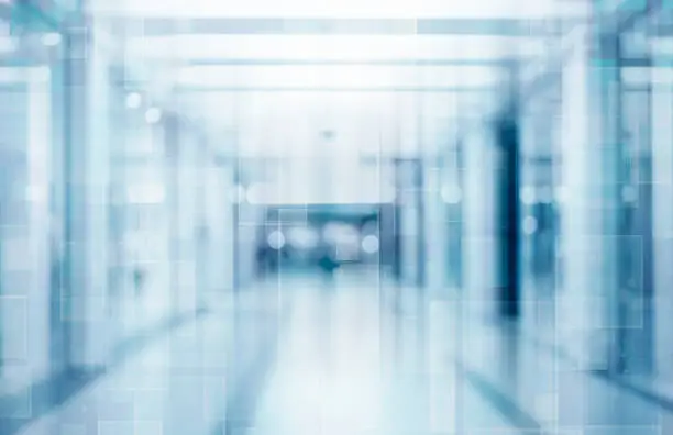 Photo of Abstract blurred interior of corridor clinic background in blue color , blurry image