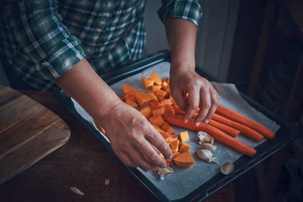 istock Cutting Fresh Pumpkins for Roasting in the Oven 1138910933