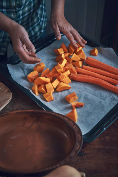 istock Cutting Fresh Pumpkins for Roasting in the Oven 1138910939