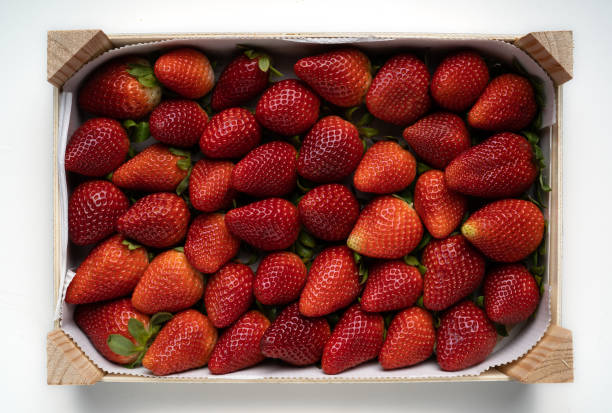 istock Strawberry in white wooden package isolated 1138913164