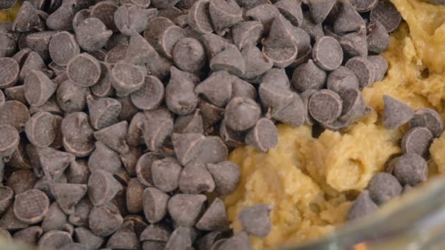 Adding Chocolate Chip Morsels to Cookie Dough in an Electric Stand Mixer - 4k