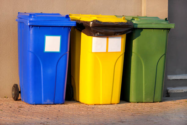 istock Trash can, garbage bin, recycling bin in tourist complex resort, waiting to be picked up by garbage truck. Blue, yellow and green containers for waste sorting, sort garbage for metal, paper and glass. 1138921696