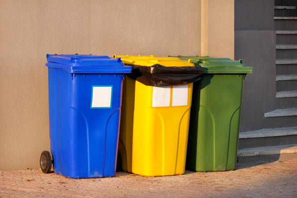 istock Trash can, garbage bin, recycling bin in tourist complex resort, waiting to be picked up by garbage truck. Blue, yellow and green containers for waste sorting, sort garbage for metal, paper and glass. 1138921782