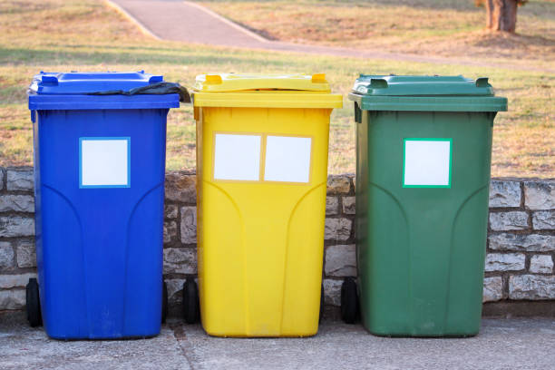 istock Trash can, garbage bin, recycling bin in tourist complex resort, waiting to be picked up by garbage truck. Blue, yellow and green containers for waste sorting, sort garbage for metal, paper and glass. 1138921812