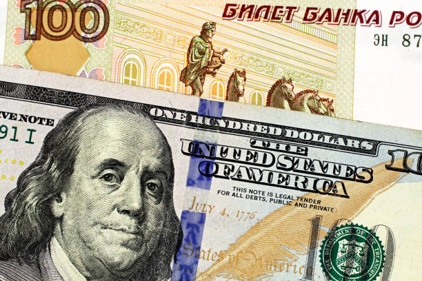 istock A Russian one hundred Ruble bank note with an American one hundred dollar bill 1138922363
