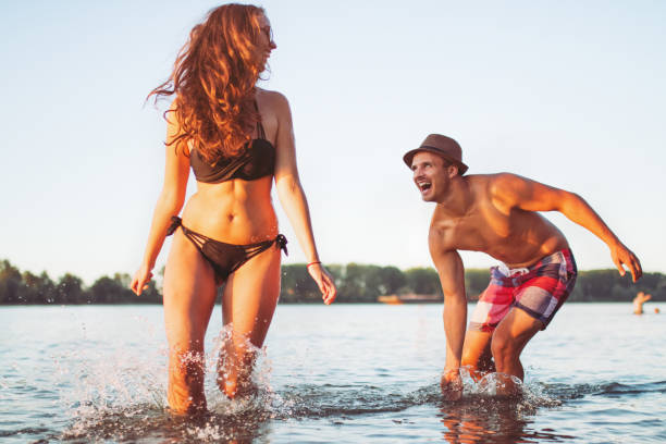 istock Young couple having fun at the beach 1138922372