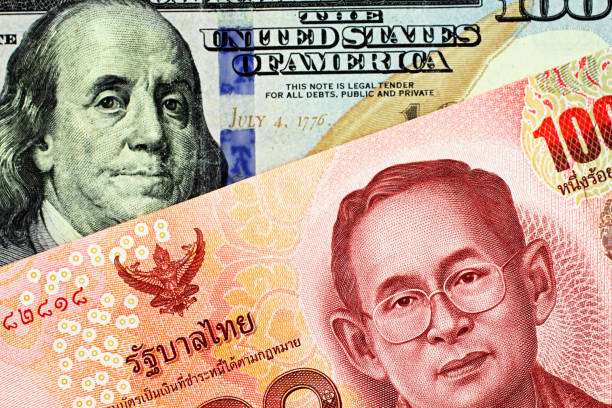 istock A one hundred Thai baht with an American one hundred dollar bill 1138923486