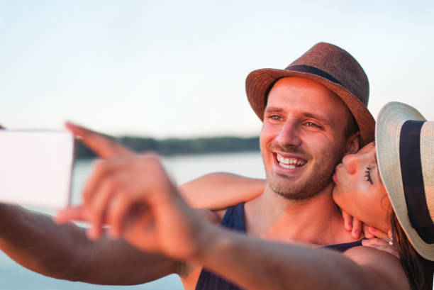 istock Young couple having fun at the beach 1138923503