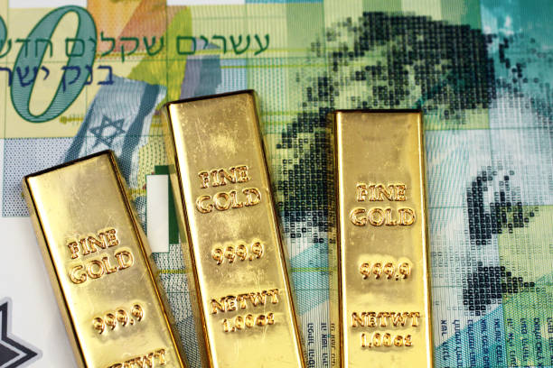 istock A twenty Israeli shekel bank note with three small gold bars 1138925092