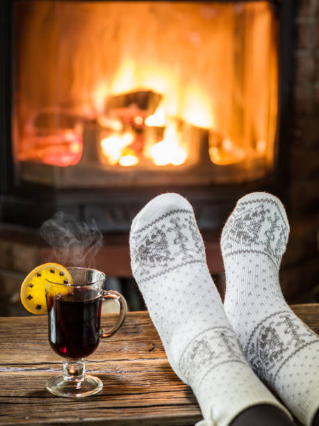istock Warming and relaxing near fireplace. 1138925237
