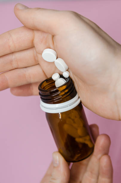 istock Pills spilling out of pill bottle 1138926999