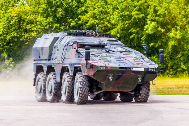 German armoured carrier, from german army, drives on a road German armoured carrier, from german army, drives on a road armored vehicle stock pictures, royalty-free photos & images