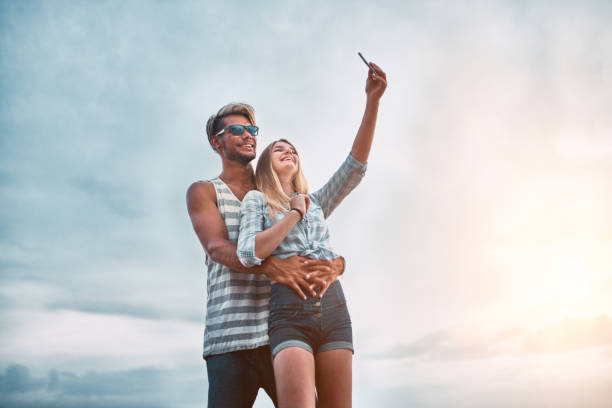 istock Young Couple taking selfie at vacation 1138928269